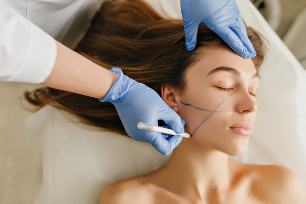 closeup-portrait-beautiful-woman-cosmetology-procedures-rejuvenation-beauty-salon-dermatology-procedure-painting-eyebrows-hands-blue-glows-work-healthcare-botox-min